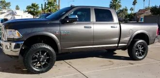 A lifted Ram 2500 truck in for drivetrain and differential work at Eagle Transmission & Auto Repair in Denton
